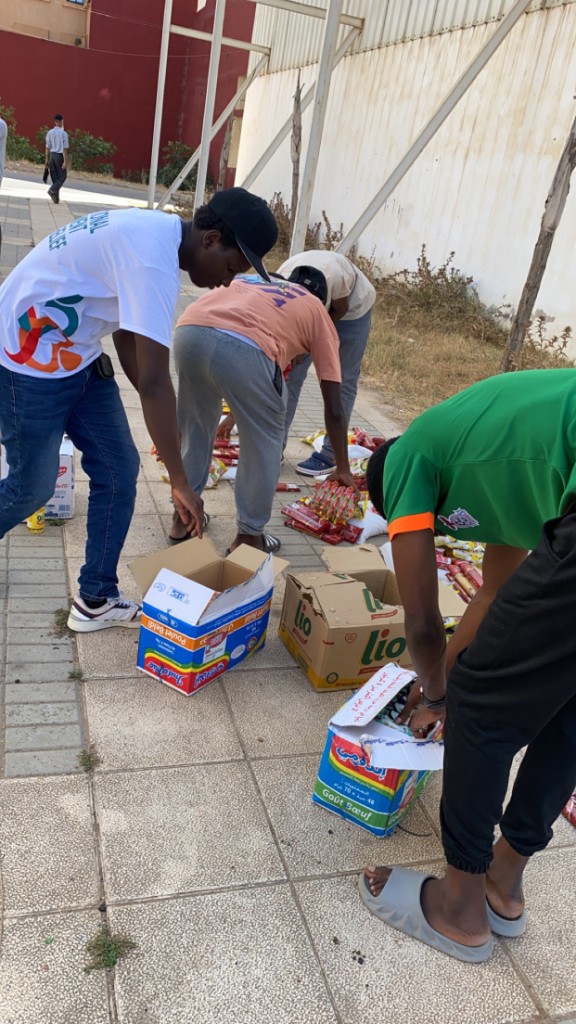Tayb Foundation Morocco outreach — Organizing rice, oil, pasta, and pantry staples for students